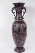 A Japanese Meiji bronze vase with two elephant mask handles, with engraved and applied birds and