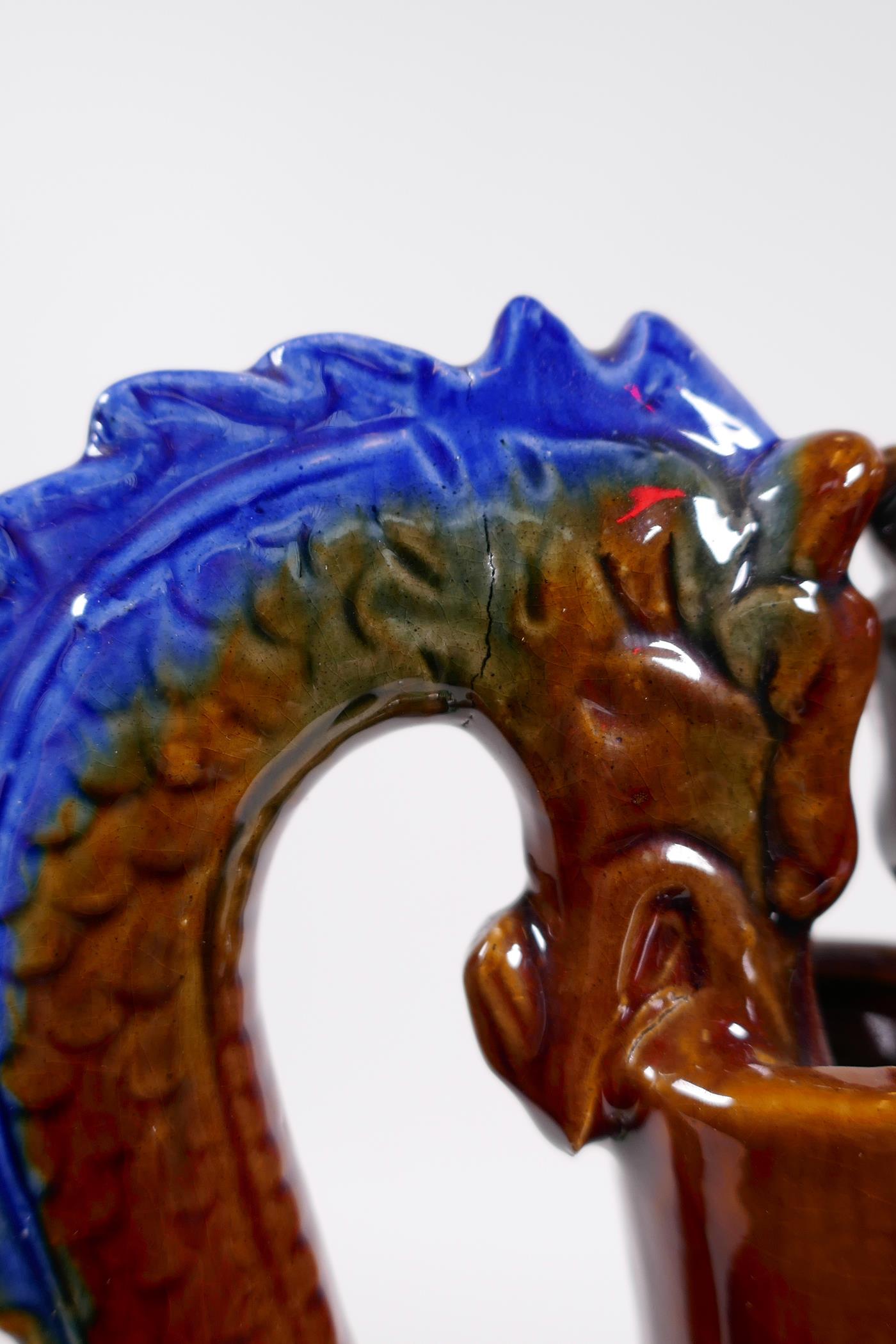 A Chinese Sancai glazed pottery vase with a slender neck and two handles in the form of dragons, - Image 6 of 6