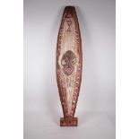 A painted wood carving, possibly from New Guinea, 36" high