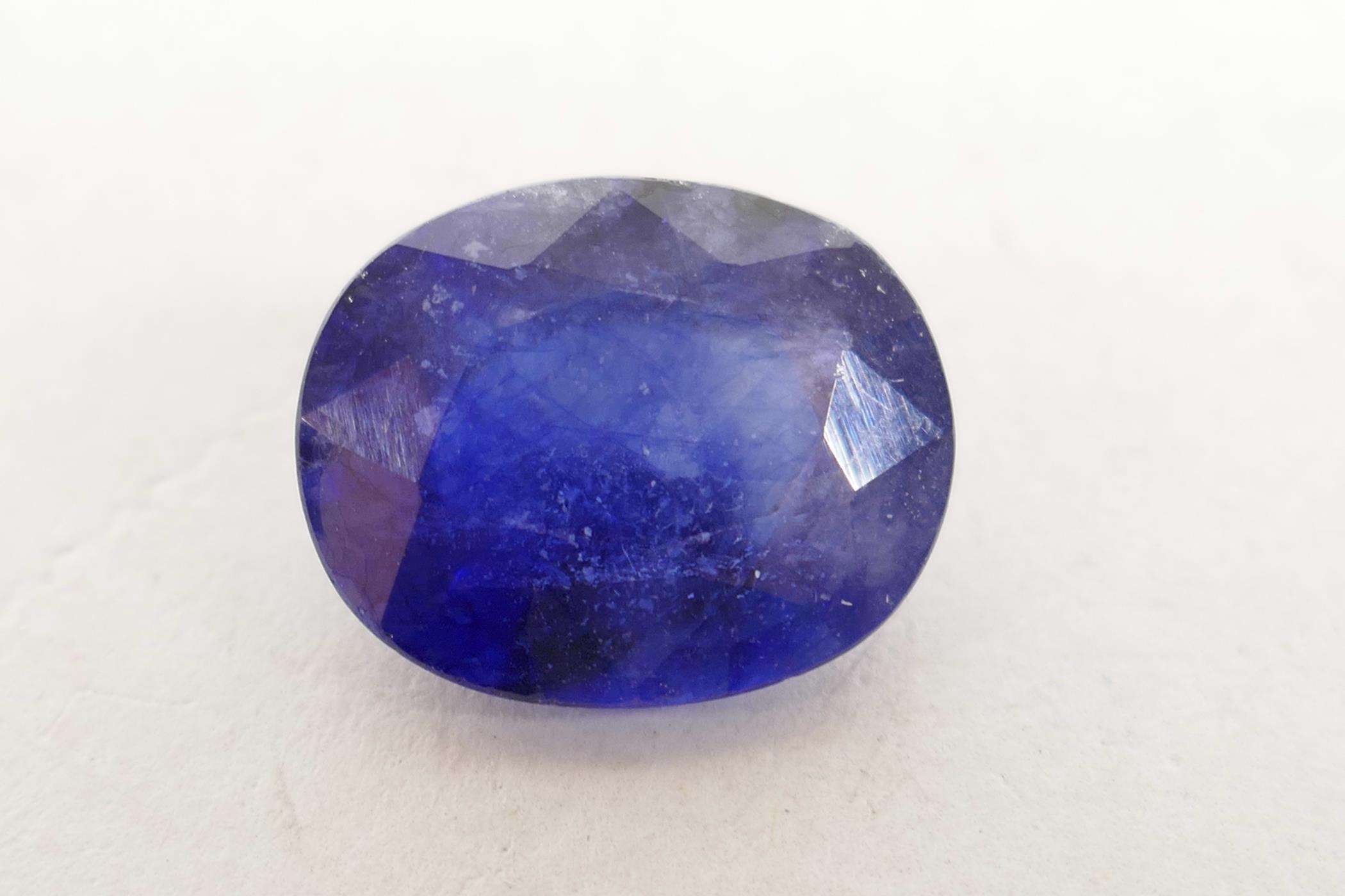 An 8.10ct blue sapphire, oval mixed cut, IDT certified, with ceritificate