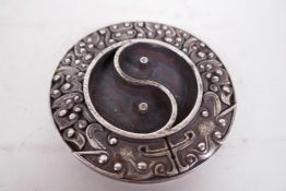 A Chinese white metal ink stone formed as the Yin Yang symbol, 3¼" diameter