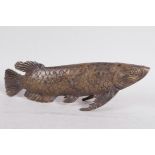 An Oriental bronze model of a fish, 11½" long