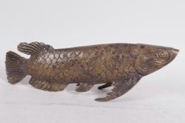 An Oriental bronze model of a fish, 11½" long