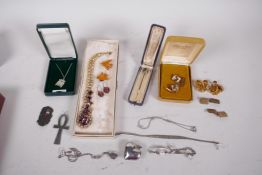 A quantity of good costume jewellery including a C19th stick pin (cased), portcullis silver pendant,