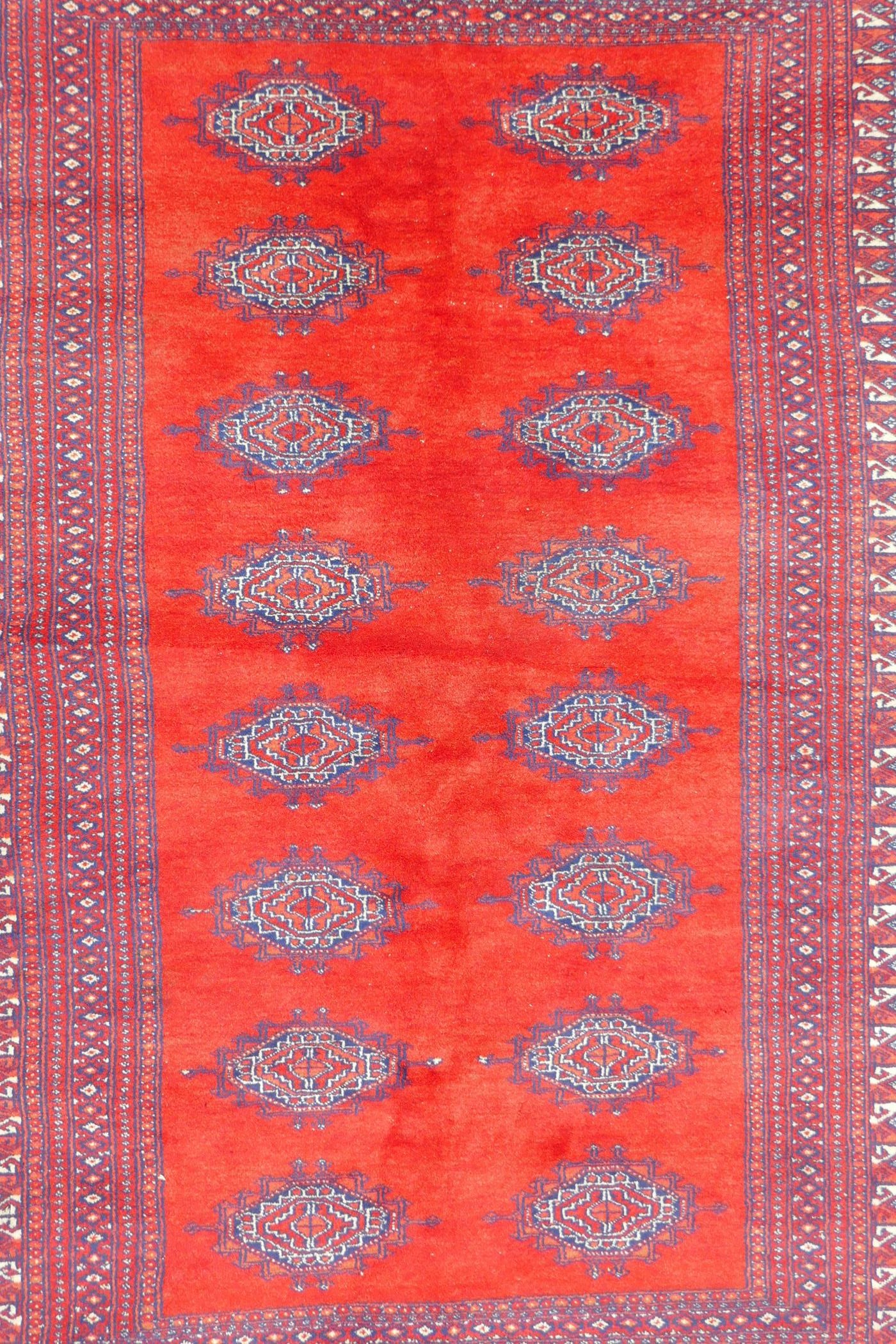 A Turkmen tomato ground wool carpet with a Bokhara design, 51" x 72" - Image 4 of 6