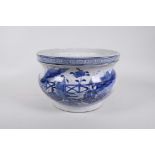 An antique Chinese blue and white porcelain jardiniere decorated with figures in a garden, seal mark