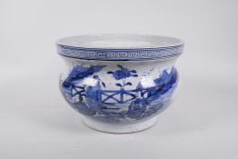 An antique Chinese blue and white porcelain jardiniere decorated with figures in a garden, seal mark
