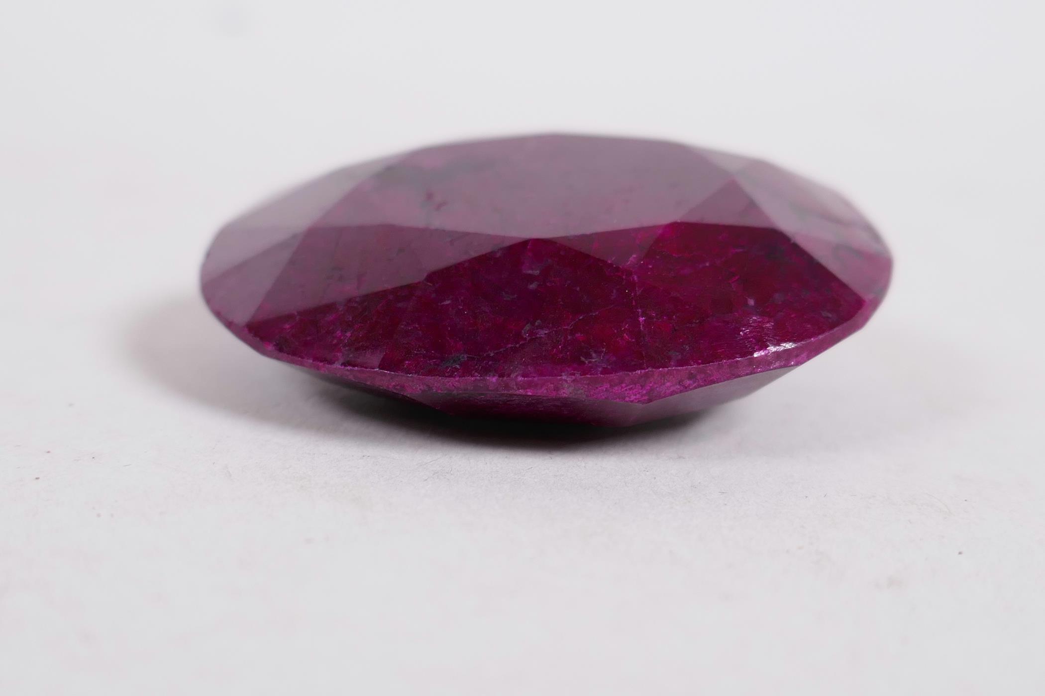 A 295ct natural ruby gemstone, oval cut, with certification from the Gemological Laboratory of India - Image 3 of 6