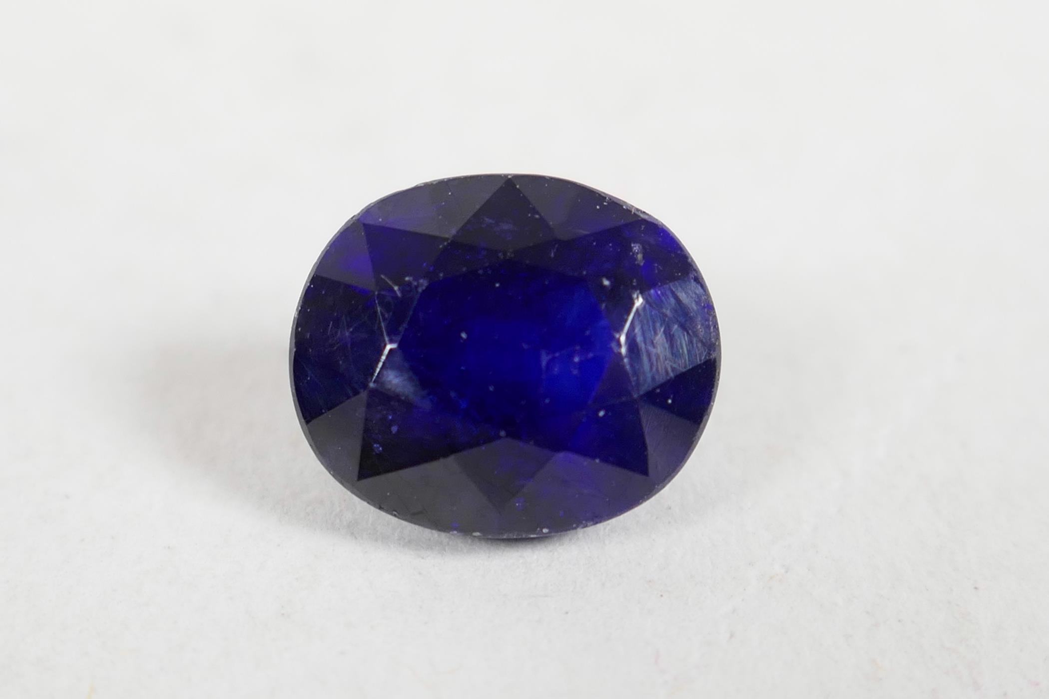 A 5.60ct blue sapphire, oval cushion cut, GJSPC certified, with certificate