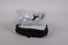 A Chinese hard paste porcelain figure of a crane, mounted on a carved and pierced wood base, bird 5"