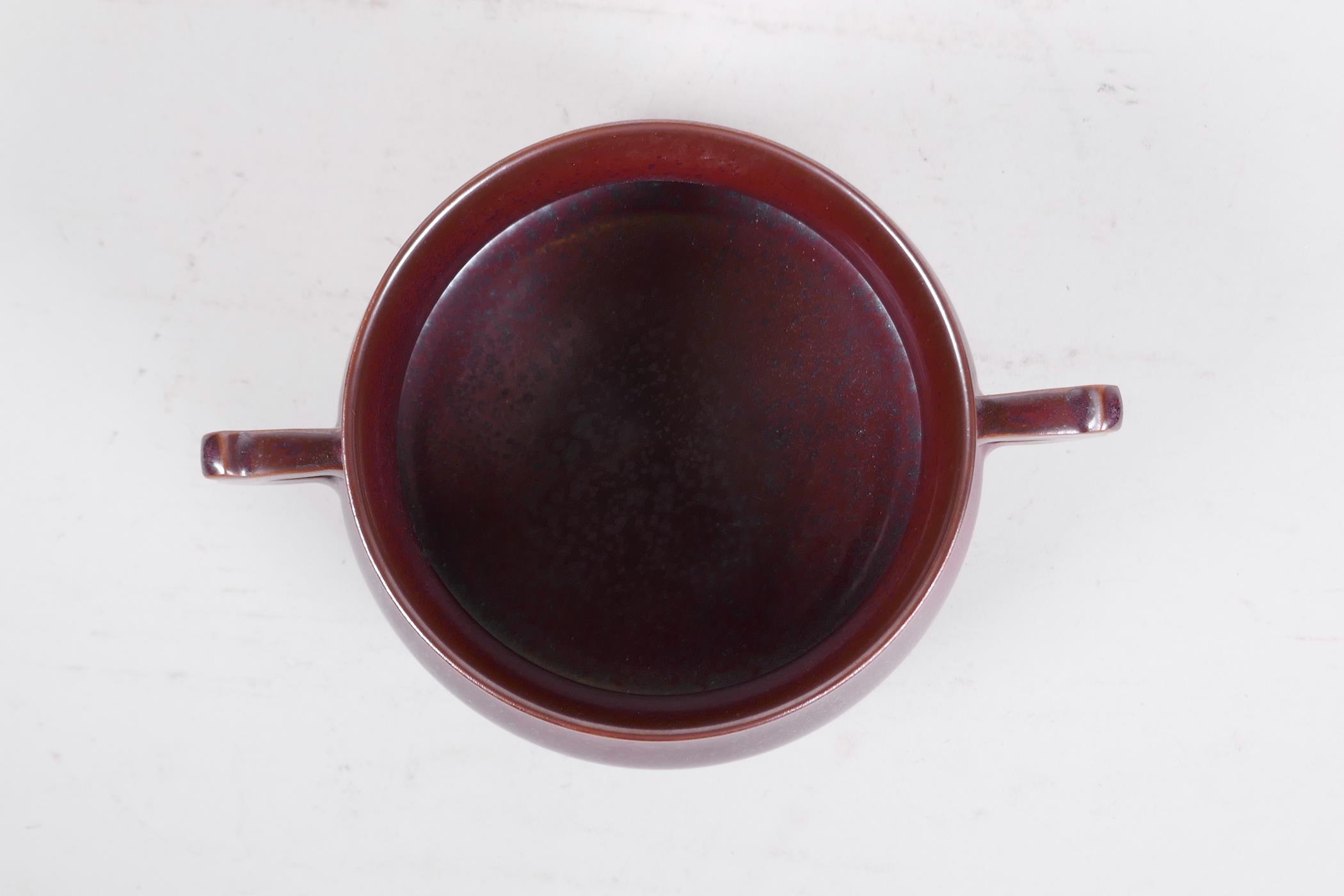 A Chinese iridescent copper glazed porcelain censer raised on tripod supports with two handles, - Image 5 of 7