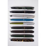 A collection of assorted Parker fountain pens to include three Parker 45's, two 65's, two 180's, a