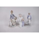 Three Lladro figurines, 'Girl with Geese', 'Sailor Boy' and 'Two Children at Bedtime', tallest 10"