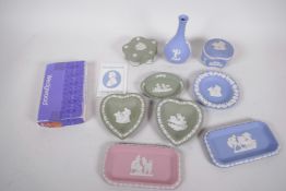 Wedgwood Jasperware, light blue bud vase, trinket box and two pin trays, light green trinket box,