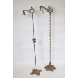 An early C20th cast iron floor lamp, with twisted column and pierced platform base, 57" high, and