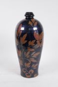 A Chinese Cizhou kiln style vase with trailing leaf decoration, 11½" high