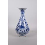 A Chinese Ming style blue and white porcelain pear shaped vase with a flared rim, decorated with