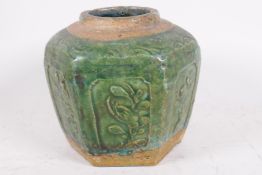 An C18th South China pottery storage jar, the surface with raised floral motifs below a mottled