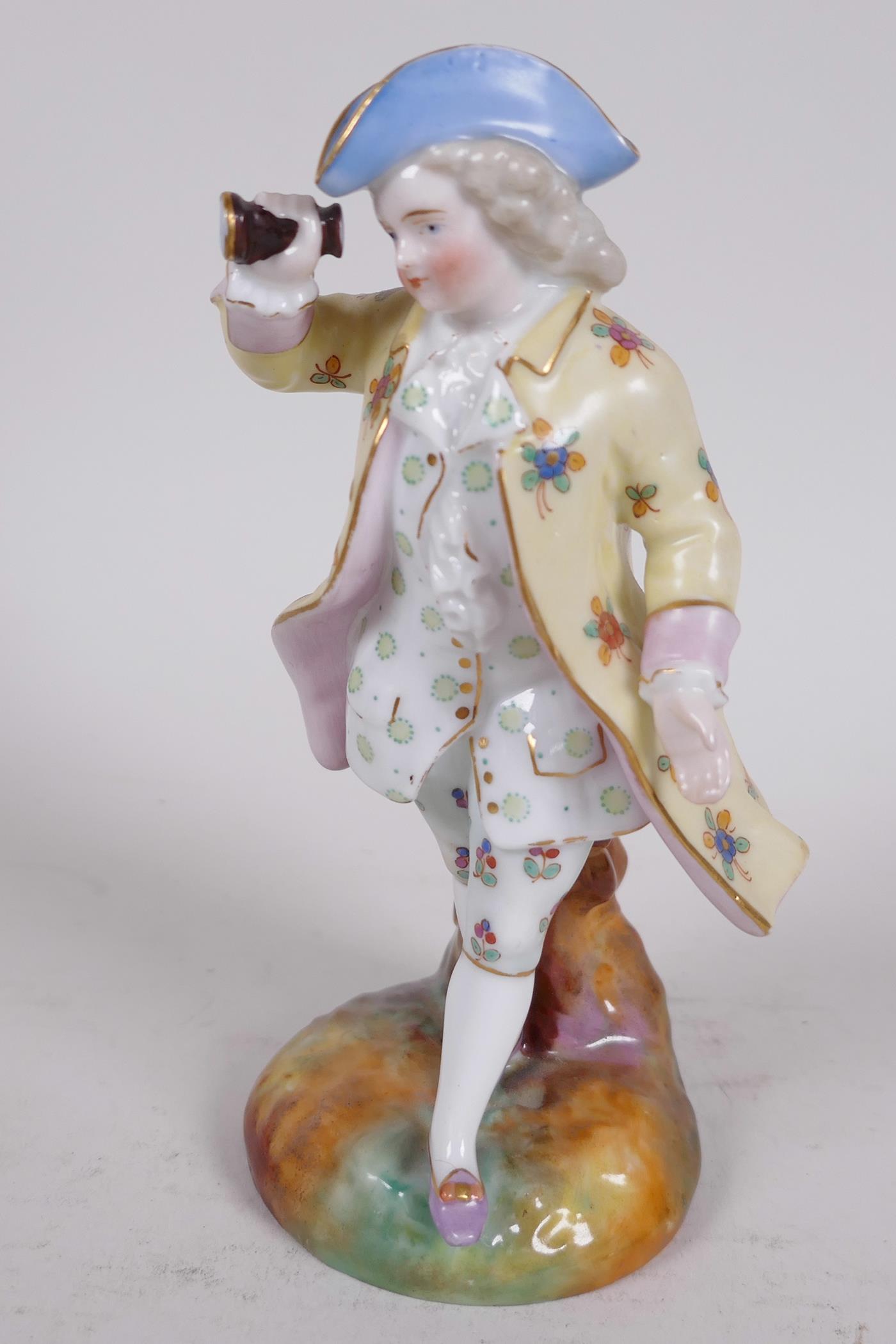 A Continental porcelain figure of a dandy with tricorn hat and spyglass, 5½" high - Image 2 of 4