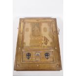 A gilt oak book box with carved heraldic decoration and inset decorative print depicting regency