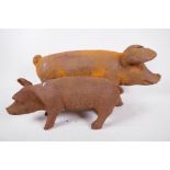 Two cast iron figures of pigs, largest 17" long