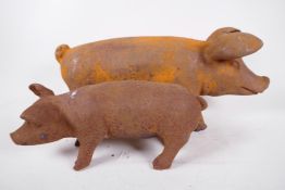 Two cast iron figures of pigs, largest 17" long