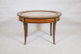 A marquetry inlaid mahogany occasional table, with brass mount and inset marble top, raised on sabre