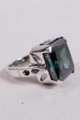 A 19.7ct blue moissanite diamond ring, princess cut, with natural inclusions, set in sterling
