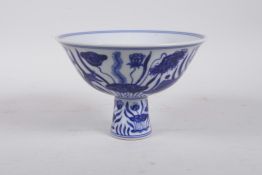 A Chinese blue and white porcelain stem bowl with carp in a lotus pond, 6 character mark to bowl, 4"