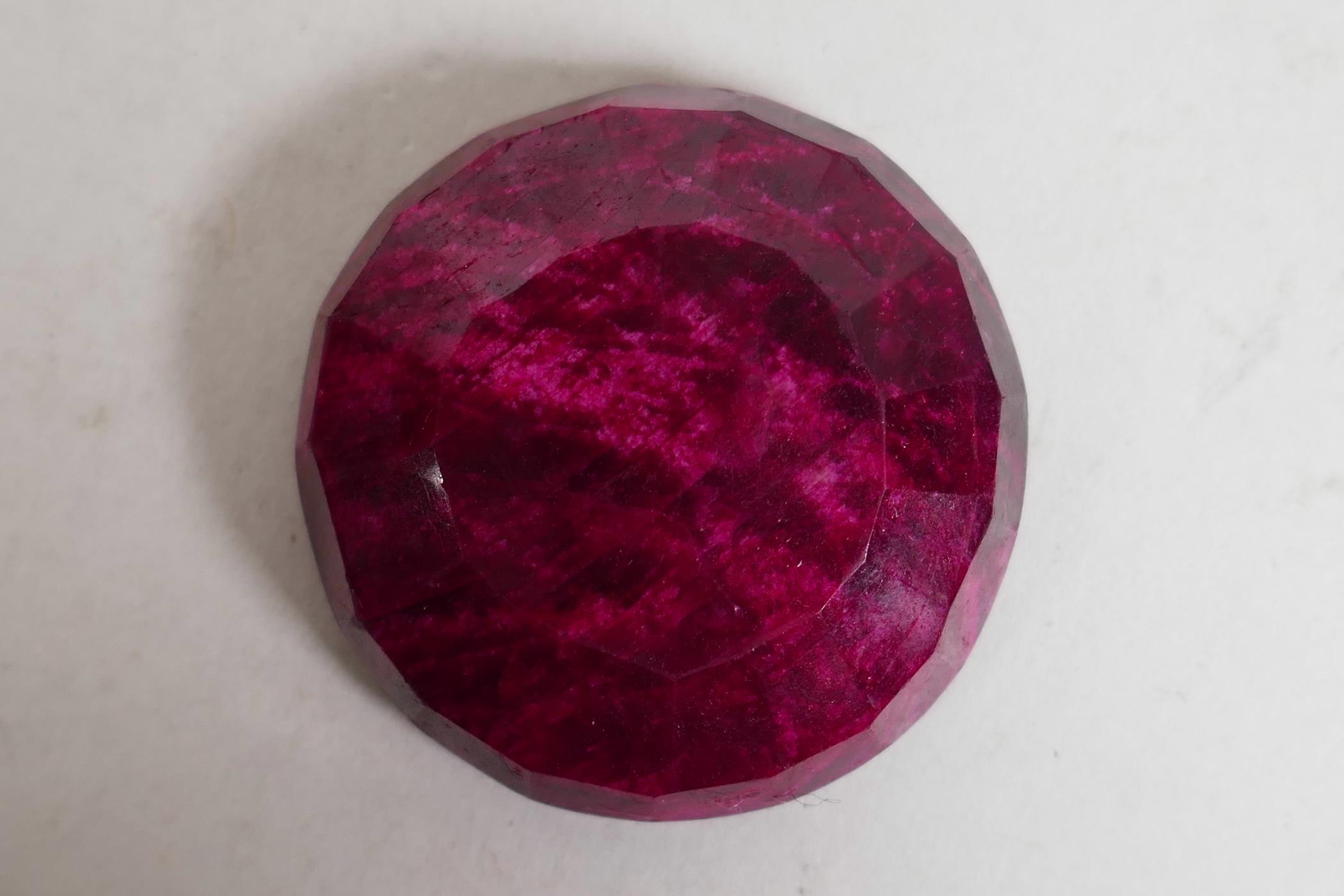 A 251ct natural ruby round mixed cut, Gemological Society of India certified, with certificate