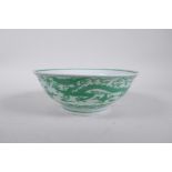 A Chinese porcelain bowl decorated with green enamel dragons, 6 character mark to base, 7½" diameter