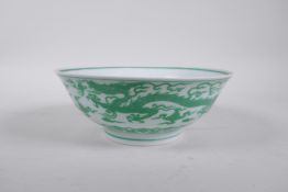 A Chinese porcelain bowl decorated with green enamel dragons, 6 character mark to base, 7½" diameter