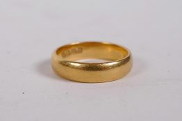 A 22ct gold wedding band, approximate size 'N'