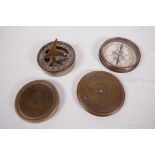 A brass cased pocket compass inscribed with a poem by Robert Frost, 3" diameter, together with a