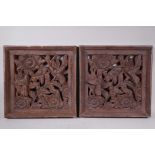 A pair of decorative pierced composition panels depicting birds and flowers, 15" x 15"