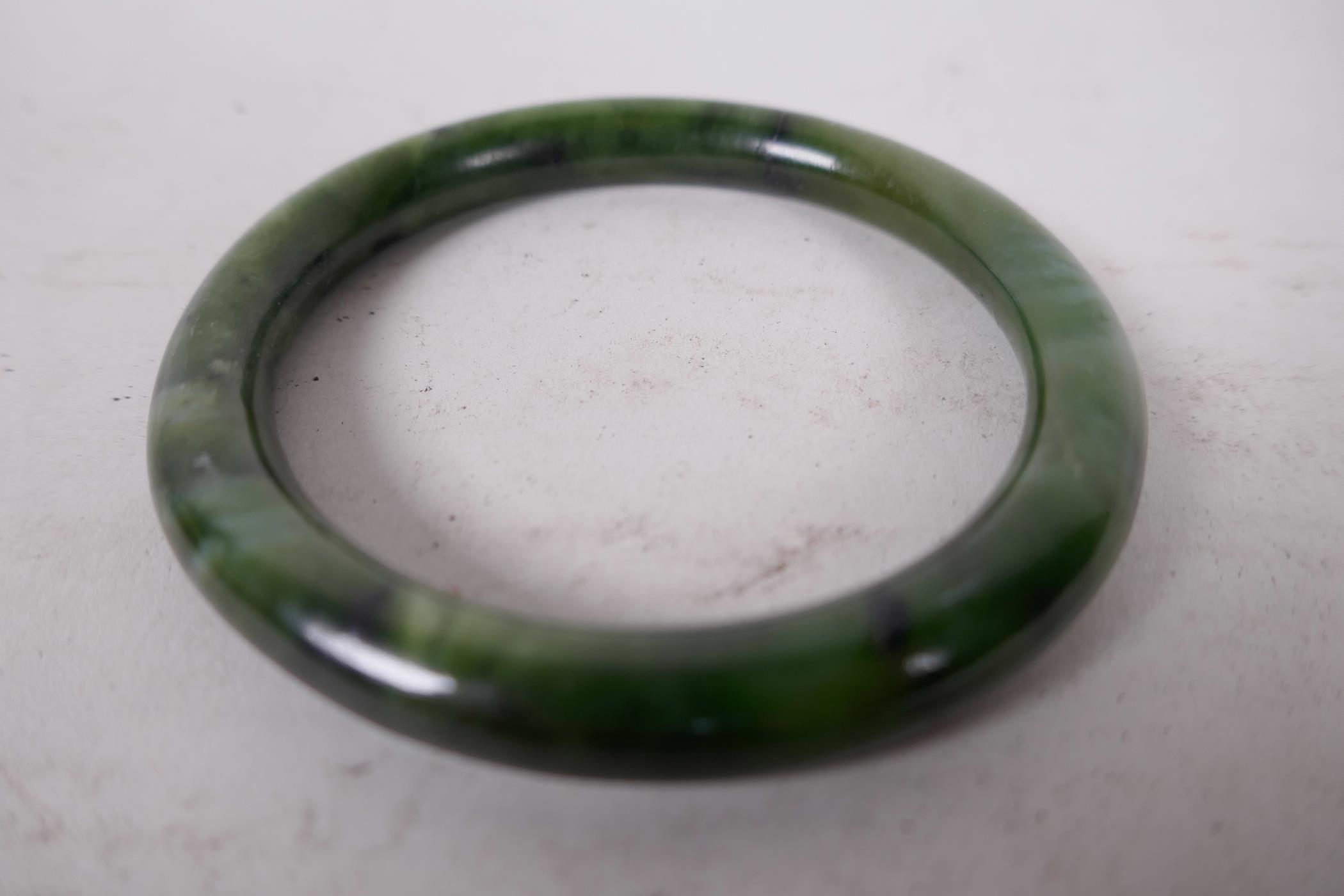 A Chinese marbled green jade bangle, 2¼" diameter, 43 grams - Image 2 of 2