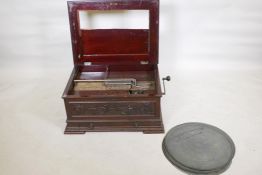 A C19th Stella polyphon, no. 675, in a mahogany case complete with 28 discs, including Bizet,
