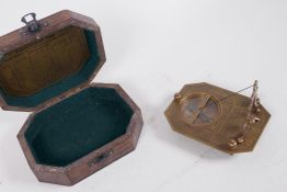 A travelling brass sundial in a hardwood box, 6" x 4½"