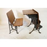 A Victorian wrought iron and oak school desk with chair, 20" x 26" high