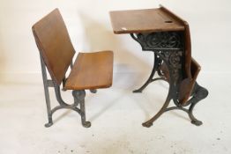 A Victorian wrought iron and oak school desk with chair, 20" x 26" high