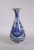 A Chinese blue and white porcelain pear shaped vase with a flared rim and stylised decoration, 11"
