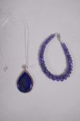 A blue tanzanite gemstone bracelet and a lapis lazuli pendant set in sterling silver with a sterling