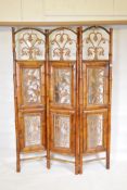 A vintage bamboo three fold screen with inset painted metal panels in Oriental frames, each fold 73"