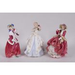 Three Royal Doulton lady figurines, 'Christmas Morn' HN1992, 'Laura' HN2960 and 'Top o' the Hill'