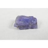 An 8.11ct natural tanzanite, rough cut, IDT certified, with certificate