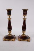 A pair of C19th French red marble and ormolu candlesticks, 10½" high