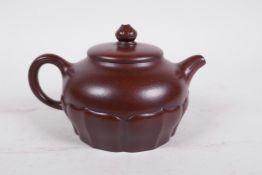 A Chinese Yixing teapot moulded in the form of a lotus flower, impressed seal mark to base, 4"