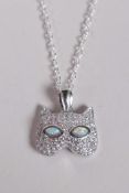 A 925 silver and cubic zirconium set pendant necklace in the form of a cat mask with opaline eyes