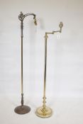 A brass adjustable floor lamp, 52" high, and another