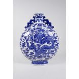 A Chinese blue and white porcelain two handled moon flask decorated with a dragon clutching the